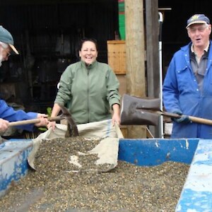 Alan John and Estelle unload gravel